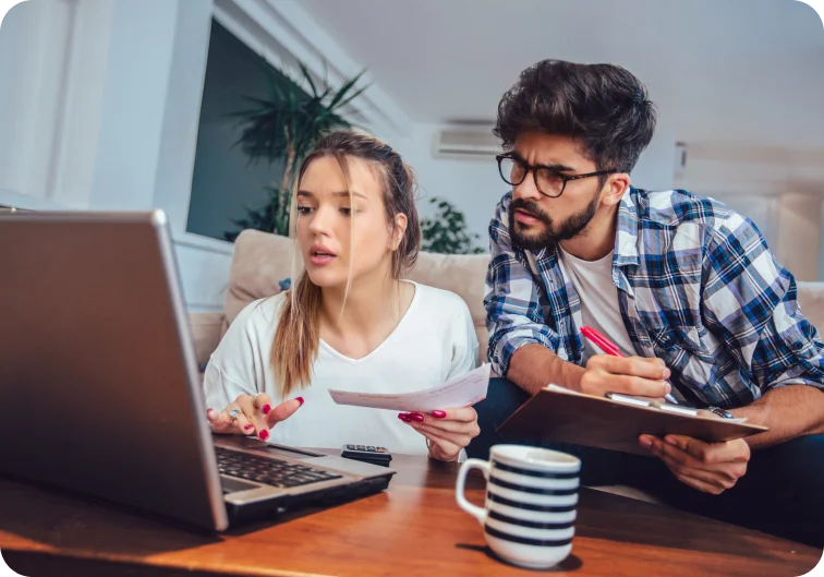 Small business owners looking confused doing their taxes